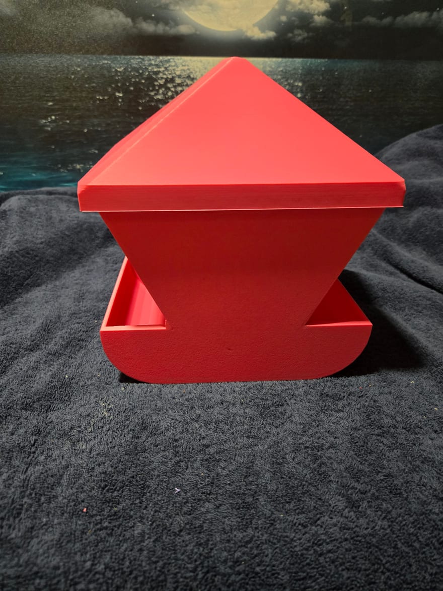 Large Feeder. The first layer went down solid, so the logo embossed into the base never formed. Where the logo should be there is a smooth blank panel.