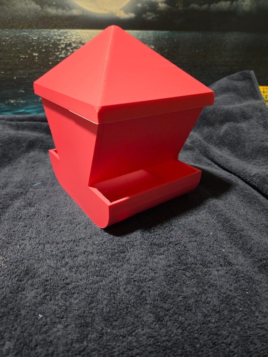 Large Feeder. The first layer went down solid, so the logo embossed into the base never formed. Where the logo should be there is a smooth blank panel.